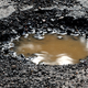 Image for article titled Neighborhood Rallies To Designate Pothole As Historic Landmark